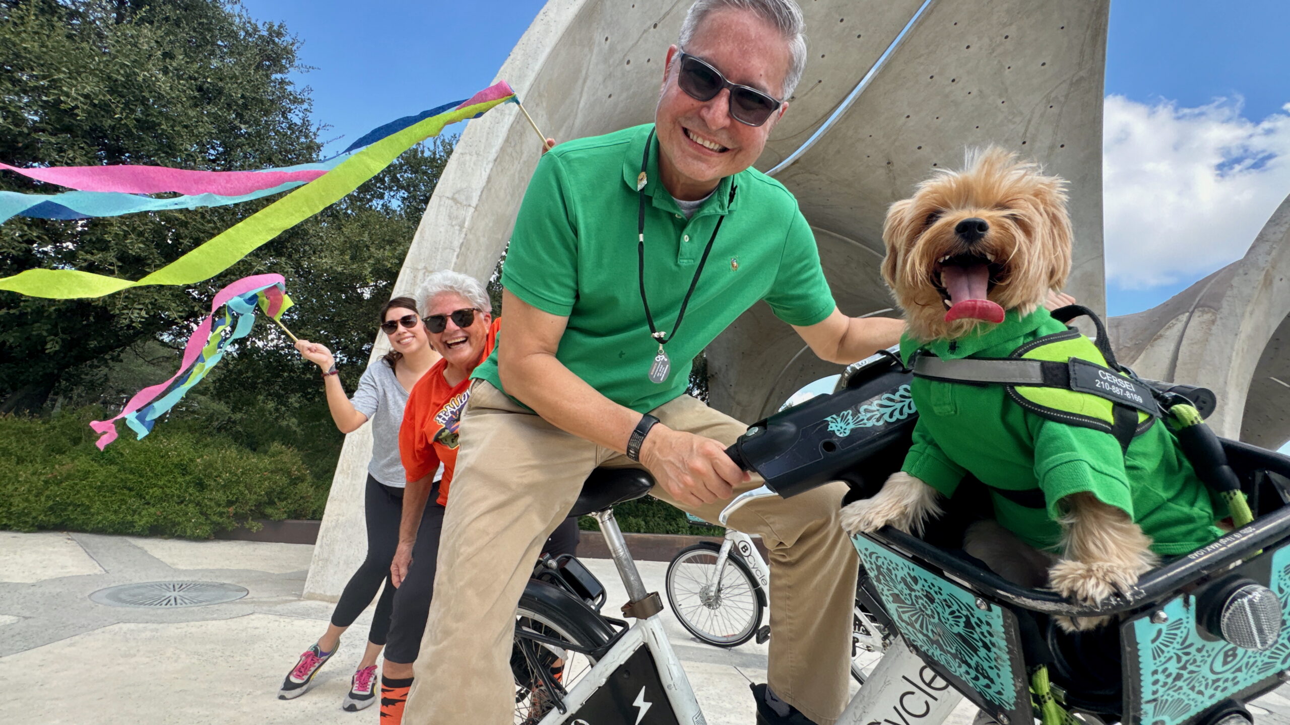 Group of senior citizens riding a bike share bicycle